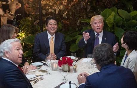 Clockwise from left, first lady Melania Trump; Prime Minister Shinzo Abe of Japan; President Trump; Abe?s wife, Akie Abe; and Robert Kraft, owner of the New England Patriots, sat down for dinner Friday. 
